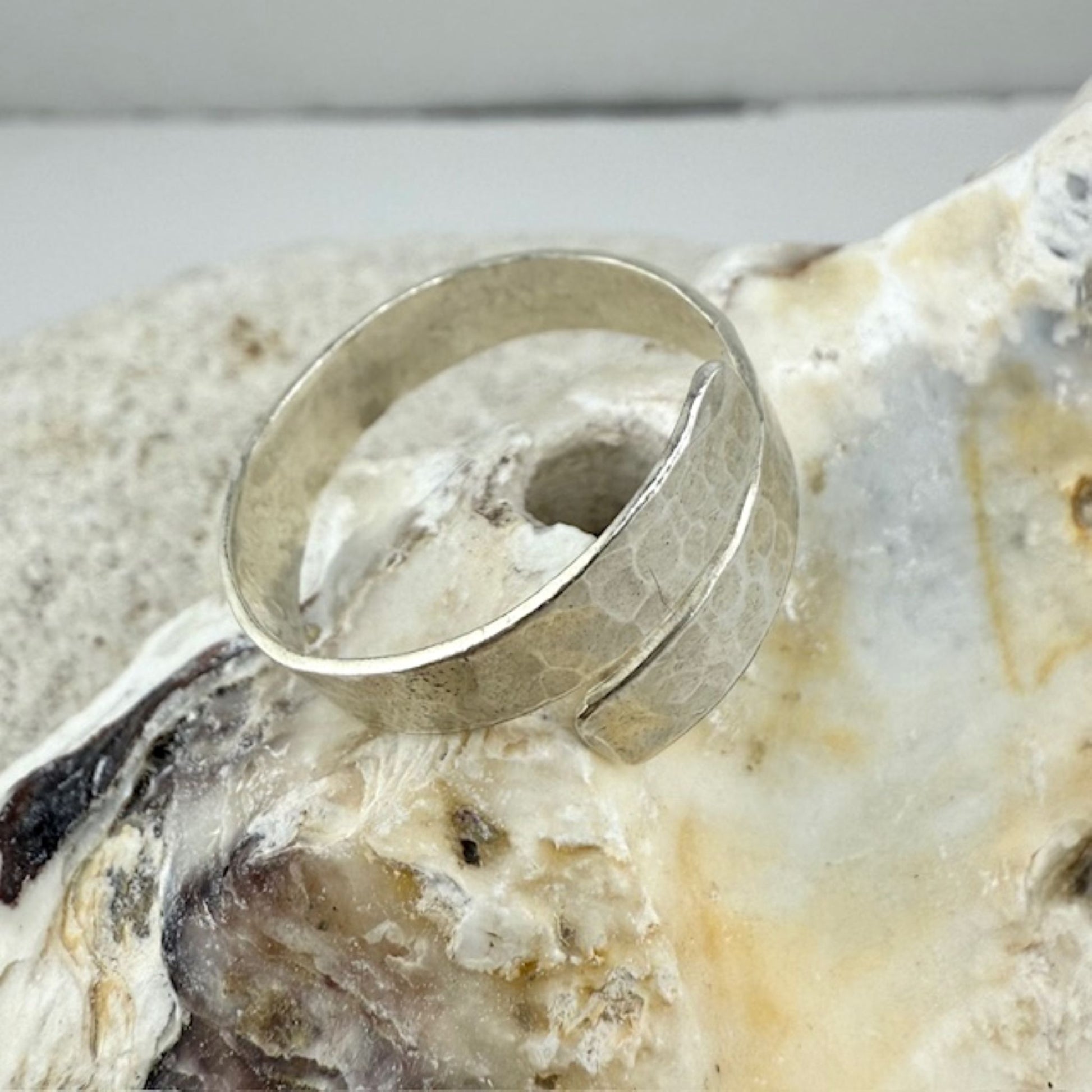 925 Silver ring on a textured stone surface