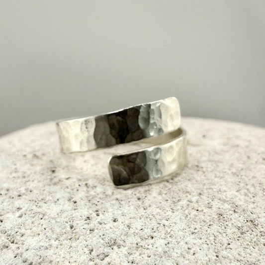 Silver ring on a textured natural stone  surface