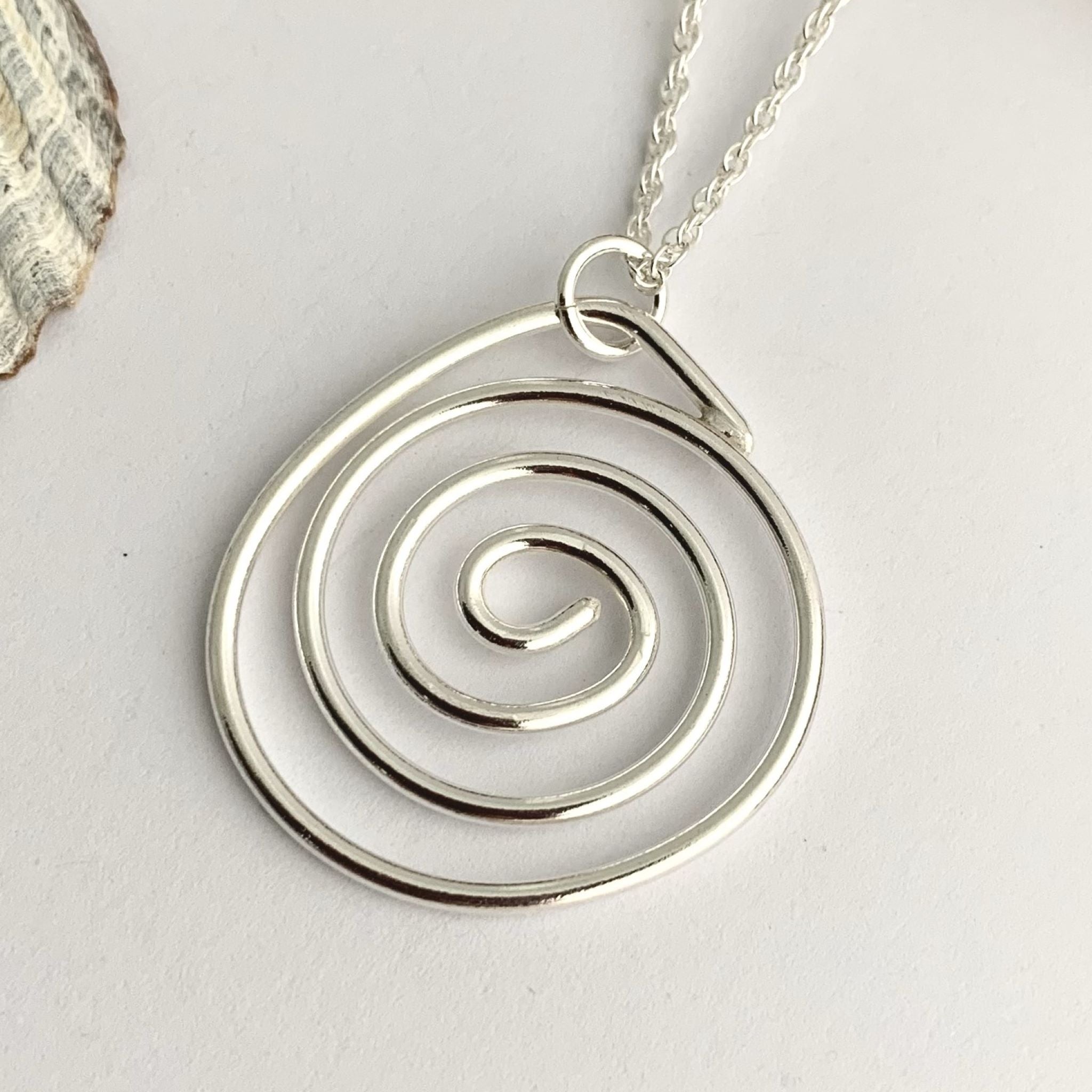 Sterling silver spiral on sale pendant